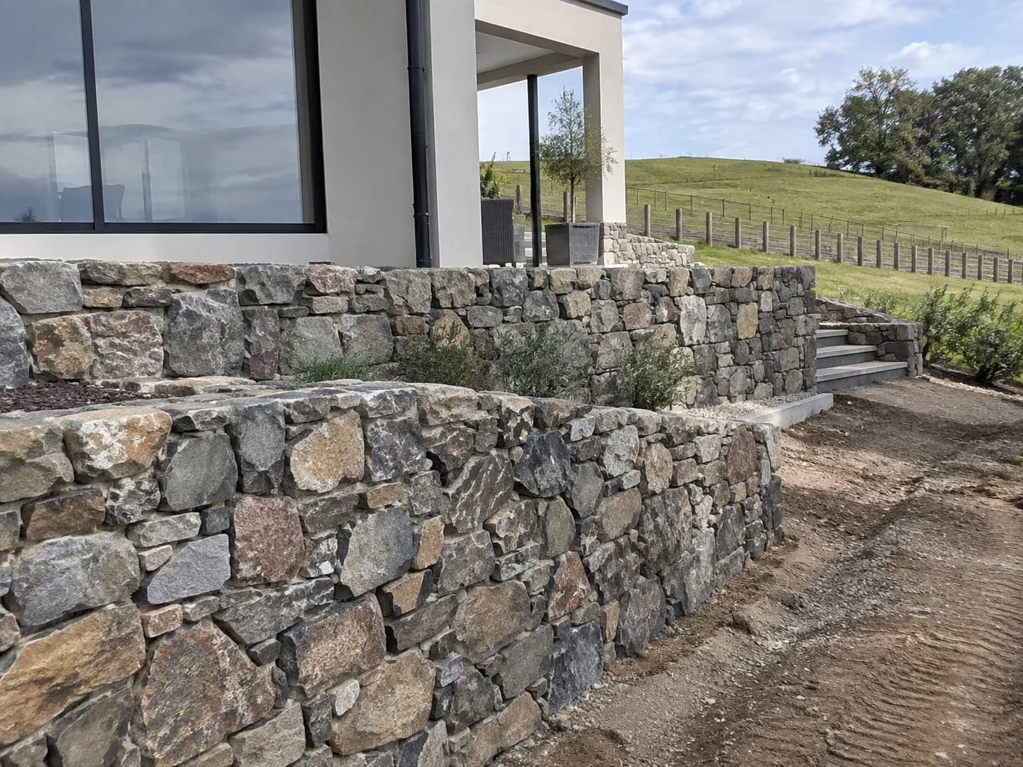 Stone veneer retaining wall on a Christchurch property frontage